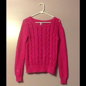 A hot pink glitter sweater