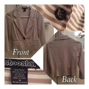 A white and gold cardigan