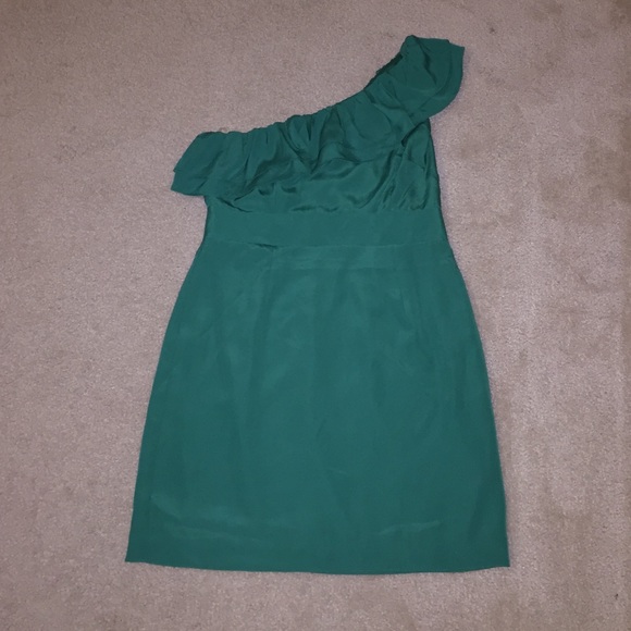Emerald green one shoulder dress.