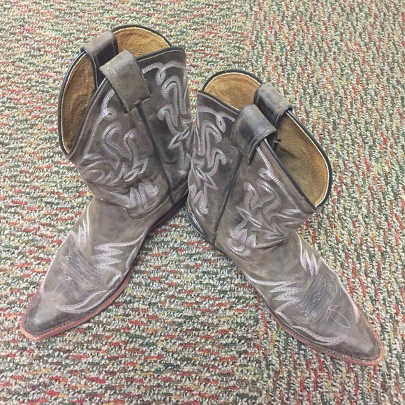 Brown cowboy boots with pink stitching detail
