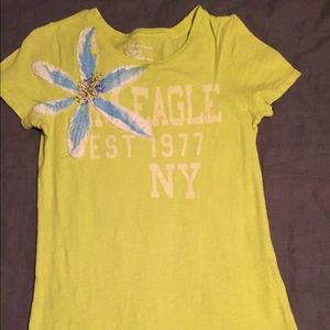 Green American Eagle shirt with blue flower