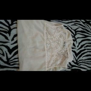 Ivory silk vest with lace back.