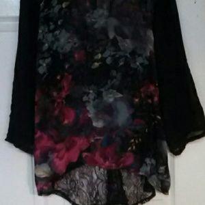 Loose fit high-low shirt with adorable back!