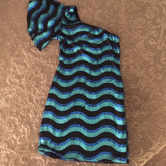 One sleeved, sparkly black, teal, and blue dress
