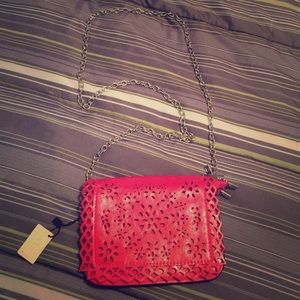 SALE!!! NWT laser cut CROSSBODY purse