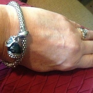 Silver toned and black bracelet.