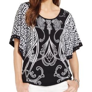 Black & white butterfly sleeve with embellishment.