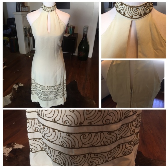 White keyhole dress with gold embelishments