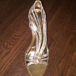 Carlos Santana gold heels