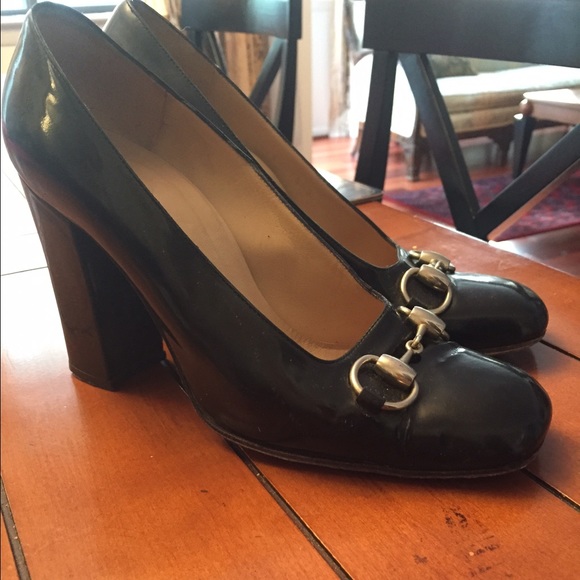 Gucci black patent leather horsebit pumps.