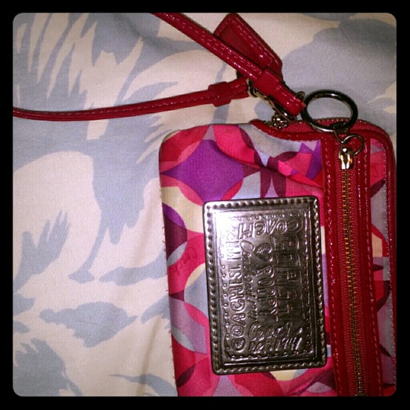 Pink coach clutch