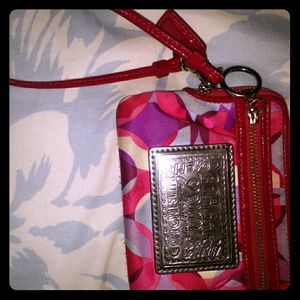 Pink coach clutch
