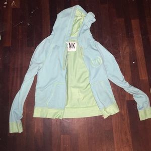 Light turquoise zip up vs pink jacket