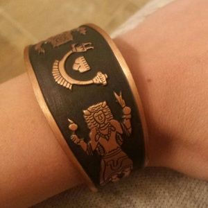 Carved copper cuff bracelet.