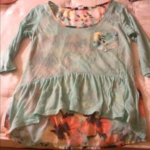 Light blue blouse w/ flowers on back.