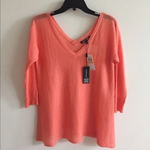 Peach color deep V neck sweater