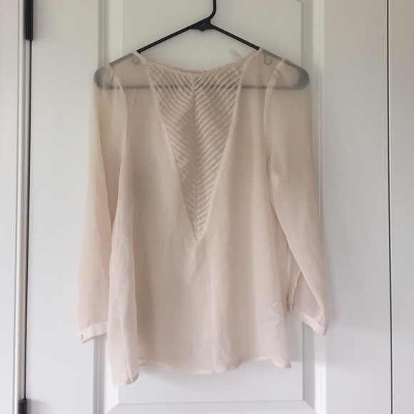 Sheer cream colored blouse