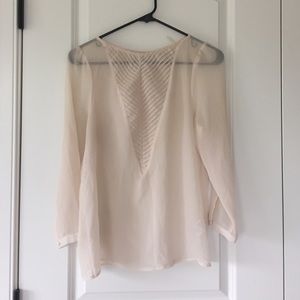 Sheer cream colored blouse