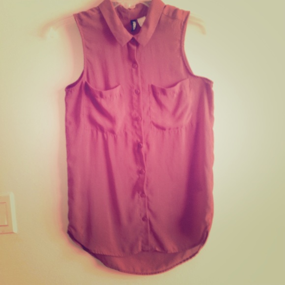 Brick red sleeveless blouse.