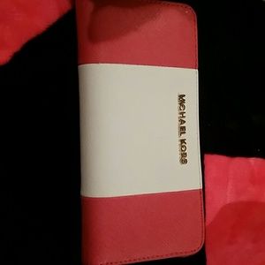 Red and white micheal kors wallet
