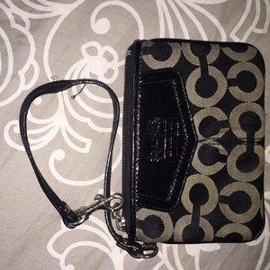 Silver and black Coach wristlet