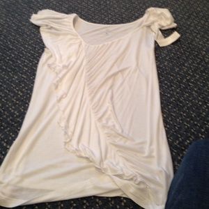 White top. one part with ruffles