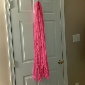 Long bright pink knit scarf