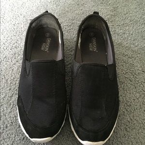 Light weight slip on black sneakers.