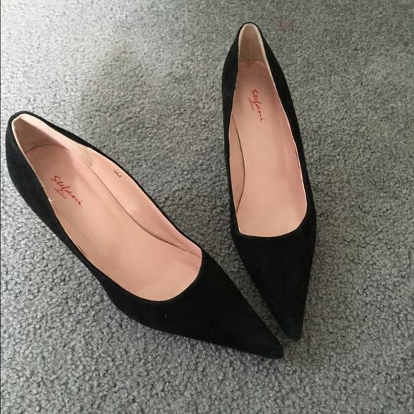 Pointy black suede heels.