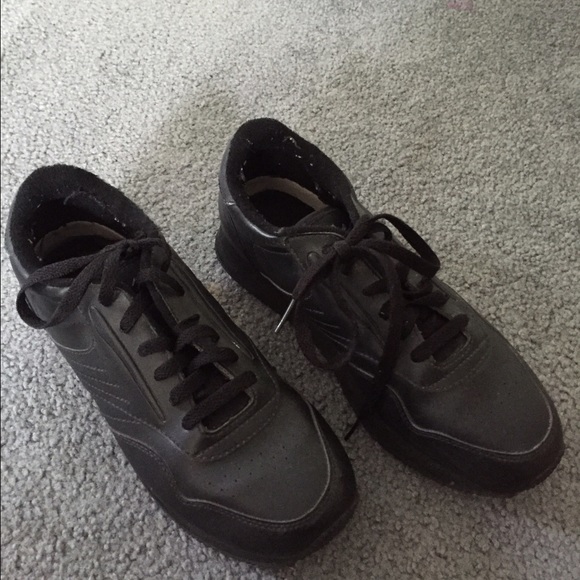 Black sneakers .