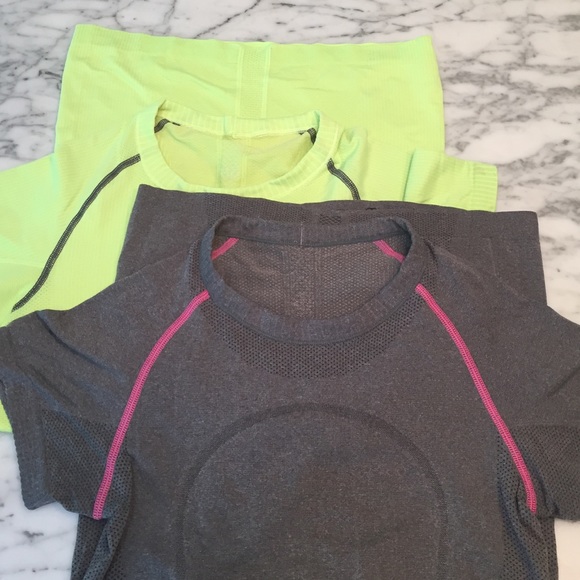 TWO shirtsleeve Lulu shirts. Size 4.