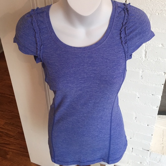 Flattering Lulu top with ruffled shoulders.