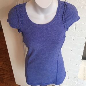 Flattering Lulu top with ruffled shoulders.
