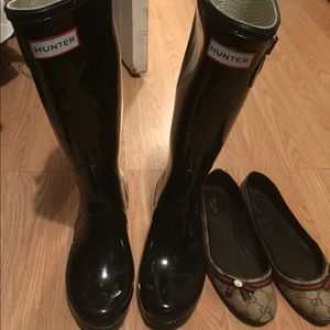 tall black shiny hunter boots