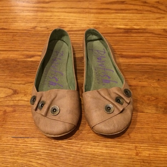 Light brown flats with button detail