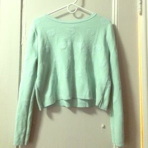 A mint green Bethany Mota sweater