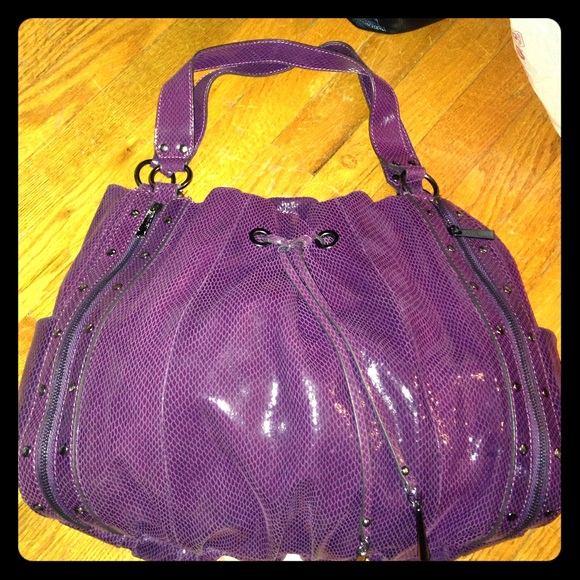 New condition purple snake skin bag