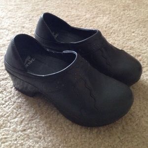 Black leather clogs