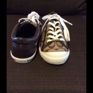 Brown Coach sneakers.