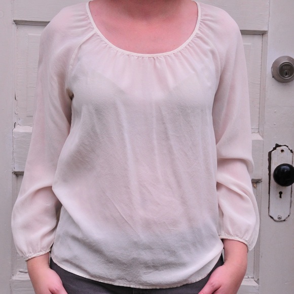Cream 100% silk, fairly sheer blouse