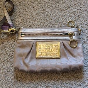 Gold coach wristlet
