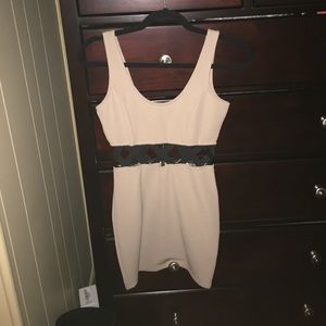 Tan dress with black x's on the torso