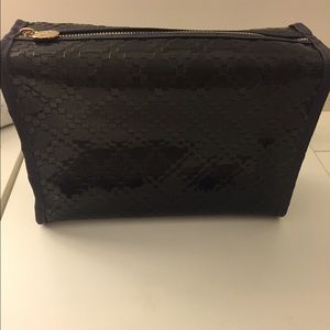 Gucci makeup bag.