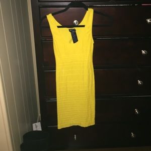 Bebe Yellow bodycon dress with open back
