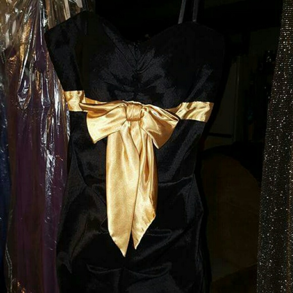 Black mini dress with gold bow