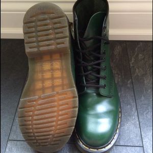 Dr Martens women matte green lace up boots.