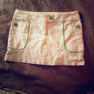 White mini skirt with green lining