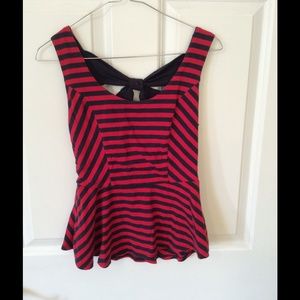 Striped peplum top with decorative back.