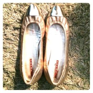 Gold Prada flats