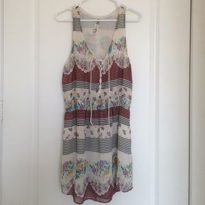 Sleeveless, lace up multi floral print dress.